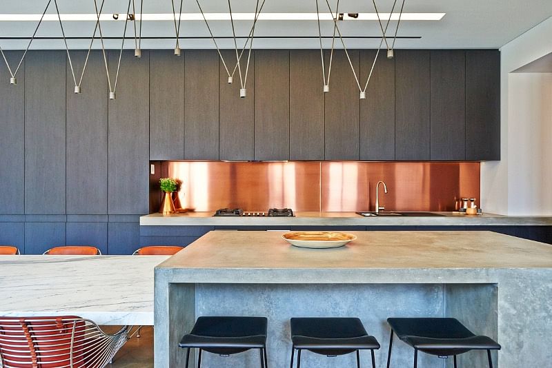Minimalist Kitchen with Copper Backsplash