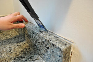 Removing the Old Caulk