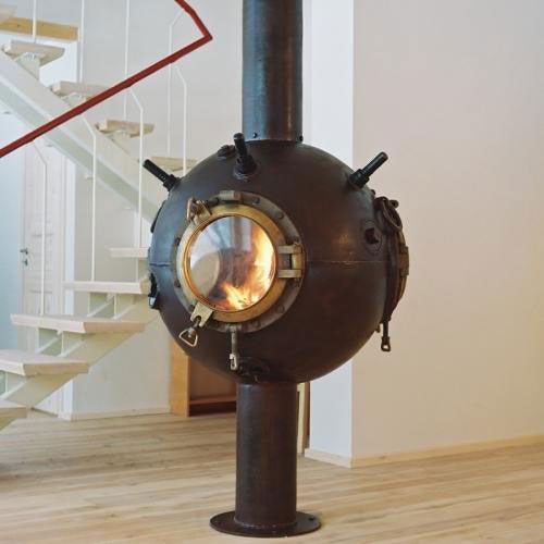 Fireplace made from a decommissioned naval mine