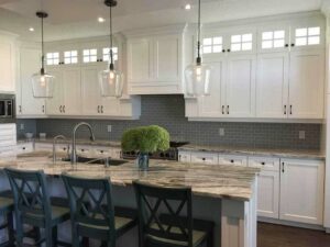 Brown-veined quartzite countertops with white cabinets