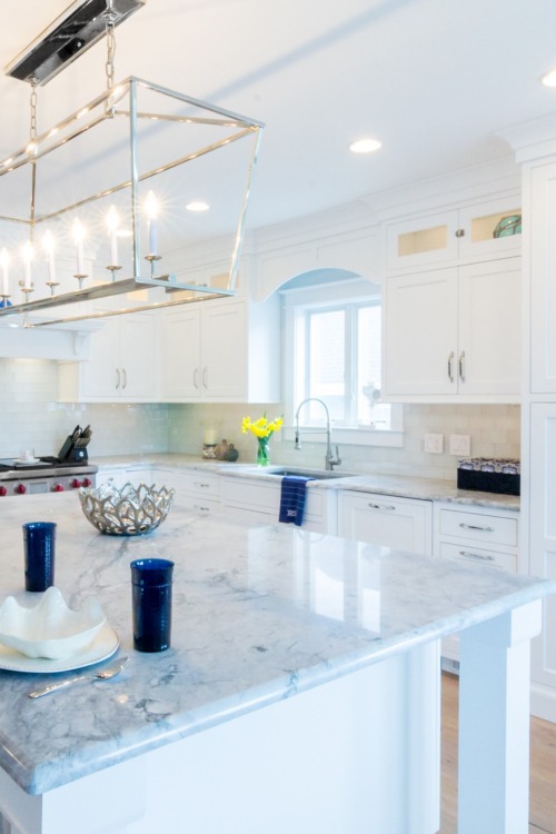 White quartzite countertops with white cabinets
